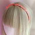 Close-up of red LED glowing hairband with tiny lights on a mannequin head decor - Red Light