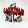 Detail of red crystal quartz points and bronze crescent moon on a handmade hair comb - Deep Red Style Three