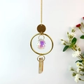 Detail of suncatcher with golden ring, rainbow crystal ball and natural stone pendant - Red Agate
