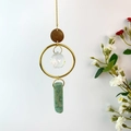 Detail of natural crystal wind chime with faceted glass ball and green amazonite stone - Amazonite