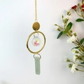 Detail of crystal suncatcher with AB multifaceted ball and light green raw stone pendant - Green Aventurine