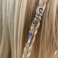 Macro detail of bohemian spiral hair ring with natural grey crystal stone on blonde braid - Gray (09)