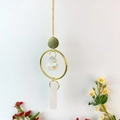Hanging crystal suncatcher with golden ring, faceted crystal ball and pink raw stone prism - Rose Quartz