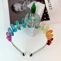 Detailed macro of handmade rainbow crystal crown with silver wire wrapping and moon charm - Multicolor Hollow Moon Green Pillar