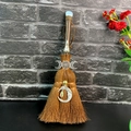 Detailed macro view of handmade witch broom with moon charm and crystal accents - White Translucent Stone Triple Goddess Style (10)