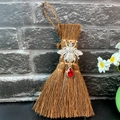 Close-up of a mini witch broom car charm with silver bee and large red crystal teardrop - Bee Style (Style 12)