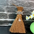 Close-up of Wicca mini broom with Triple Moon metal decor and pink crystal pendant - Triple Moon Style (Style 13)