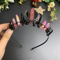 Close-up of handmade gothic crown featuring black raw stones and silver crescent moon - Red and Black Mixed Color