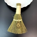 Close-up of a mini straw wizard broom featuring a vintage gold sun face charm pendant - Anthropomorphic Face Sun Style (12)
