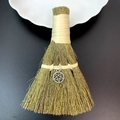 Detail of handmade fiber broom with metallic pentagram charm on a black surface - Metal Pentagram Style (11)
