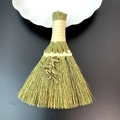 Macro shot of straw broom charm with a bronze witch pendant for festive decoration - Witch Riding Broom Style (07)