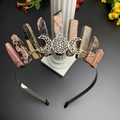 Detail view of handmade triple moon crown with natural pink crystal and black wire - Rhodonite & Triple Moon