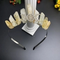 Macro view of raw quartz crystals and Triple Moon symbol wired on a black metal crown - Citrine & Triple Moon