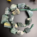 Detail of natural green agate raw stones with hand-woven rope for DIY jewelry making - Moss Agate