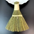 Close-up of handmade straw decorative broom with yellow ribbon and silver star charm - Silver Pentagram Style (25)