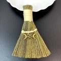 Detailed macro view of a handmade straw witch broom featuring a triple moon metal pendant - Pentagram Triple Moon Style (14)