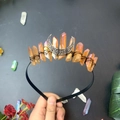 Detail view of handmade aurora crystal triple moon crown with orange raw stones and crescent - Milk Tea Black