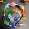 Macro view of colorful irregular raw crystal stone beads with natural rough textures - Cat's Eye Effect