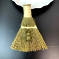 Detail showing a handmade decorative straw broom with a vintage bronze bee pendant detail - Bronze Bee Style (18)