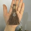Close-up of handmade mini witch broom with twine wrap and silver pentagram pendant - Natural Wood Broom + Pentagram / 10cm