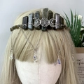 Detailed view of bohemian labradorite crown with hanging metal chains and crystal drops - Labradorite