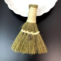 Macro detail of a handmade straw altar besom featuring a silver moon and star pendant charm - Moon and Stars Style (22)