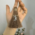 Macro detail of handmade mini straw broom keychain with silver crescent moon charm - Natural Wood Broom + Moon Face / 10cm