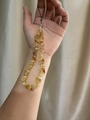Natural yellow citrine crystal stone phone strap with silver clasp held in hand - Citrine