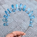 Detail of blue natural crystal crown with handmade silver wire wrapping on headband - Blue