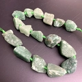 Irregular green aventurine raw stone beads on a green cord for DIY jewelry making - Green Aventurine