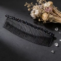 Detail view of handmade 40-tooth hair comb featuring polished black crystal stones - Garnet (40 Teeth)