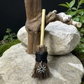 Miniature handmade witch broom with wood handle and silver sun charm on natural rock - Broom with Flower Charm