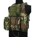 Tactical vest in woodland camouflage with modular MOLLE pockets on black mannequin - Jungle Camouflage