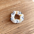 White football pattern fabric scrunchie with yellow accents on a wooden background - Yellow Soccer (6#)