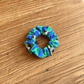 Blue and green football pattern fabric scrunchie displayed on a natural wooden surface - Blue-Green Soccer (16#)