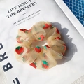 Cream organza scrunchie with red strawberry print for elegant hair styling - Light Orange