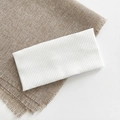 Minimalist white knitted wide headband featuring a ribbed texture and soft elastic fabric - White