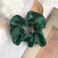 Elegant emerald green organza scrunchie with silky finish on a decorative straw mat - Dark Green Basic Scrunchie