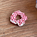 Striped fabric scrunchie with red and white horizontal patterns on a wooden surface - Medium / Rose Red