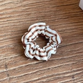 Brown and white horizontal striped fabric scrunchie on dark wooden background - Medium / Caramel color