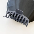 Matte dark grey oversized shark hair claw clip with a minimalist dragon bone design - Blue Gray