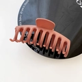 Large matte brick red hair claw clip in a minimalist dragon bone design for thick hair - Rust Red