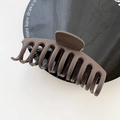 Matte dark brown large hair claw clip with 12 strong teeth on a black display plate - Brown Red