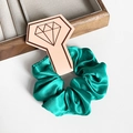 Elegant emerald green silk scrunchie on retail card display for women's ponytail hair - Sea Green