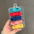 Handheld view of 25pcs seamless elastic hair bands in five bright colors with storage box - Multicolor Series