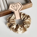 Elegant champagne gold satin scrunchie hair tie with silky gloss finish for women - Bronze