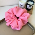 Oversized bright pink organza scrunchie with soft ruffled texture in a golden tray - Large / Hot Pink