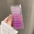 9-piece gradient purple and pink spiral telephone wire hair ties set in a clear box - Pink