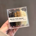 Set of 6 high elasticity spiral hair ties in neutral colors shown in a clear box - Black Brown and Off White Style