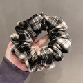 Classic black and white checkered fabric scrunchie with a soft pleated texture - Black